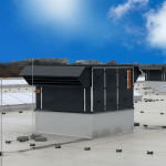 Air handling units on the roof of a large building under a blue sky.